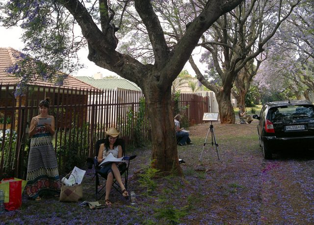 Jacaranda trees being painting by the artists.
